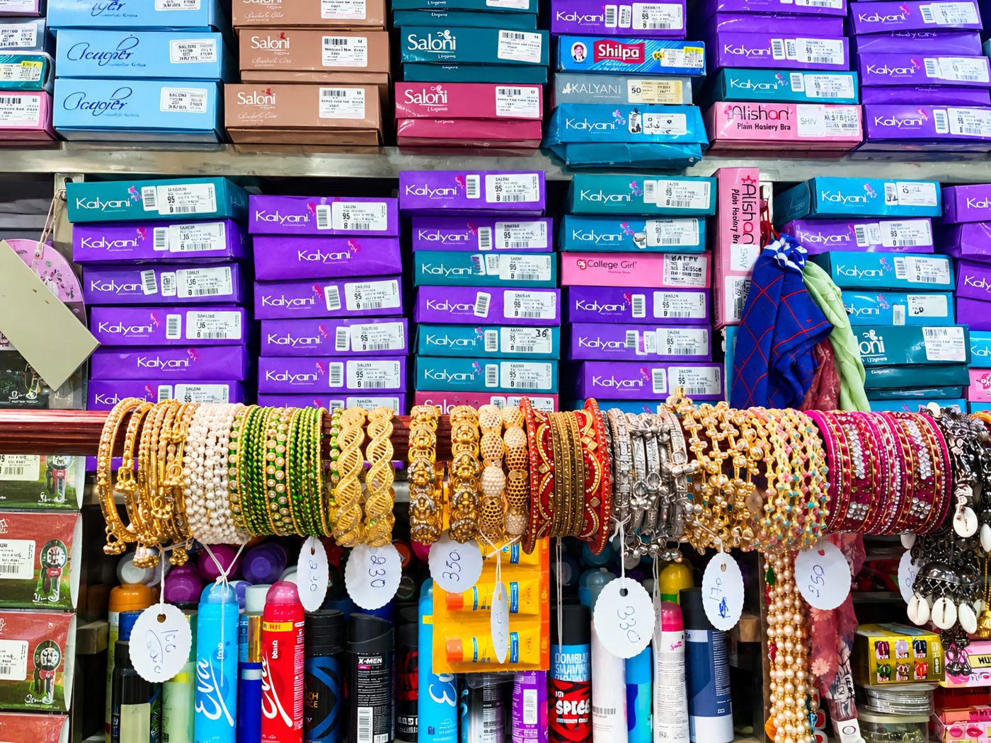 Bangles, inner wear and cosmetics shelves at Shiv Attraction House, Udhampur